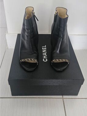 CHANEL Black Leather Ankle Boots with Gold Chain Trim